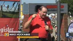 Former Arkansas Governor Mike Huckabee addresses the crowds on the Presidential Soapbox during the Iowa State Fair. 