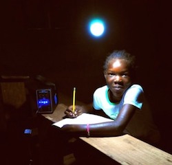 Child-using-an-energy-kiosk-in-Kenya-300