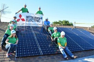 Mitsubishi Electric Green Team volunteers, students from CSULB Disabled Student Services and GRID Alternatives project leader pose in front of a newly installed 3.24kW solar system in Los Angeles. (Photo: Business Wire)